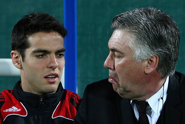 DUBAI, UNITED ARAB EMIRATES - JANUARY 06: Kaka (L) of AC Milan speaks with Carlo Ancelotti (R), manager of AC Milan before the Dubai Football Challenge match between AC Milan and Hamburger SV at The Emirates Sevens Stadium on January 6, 2009 in Dubai, Un